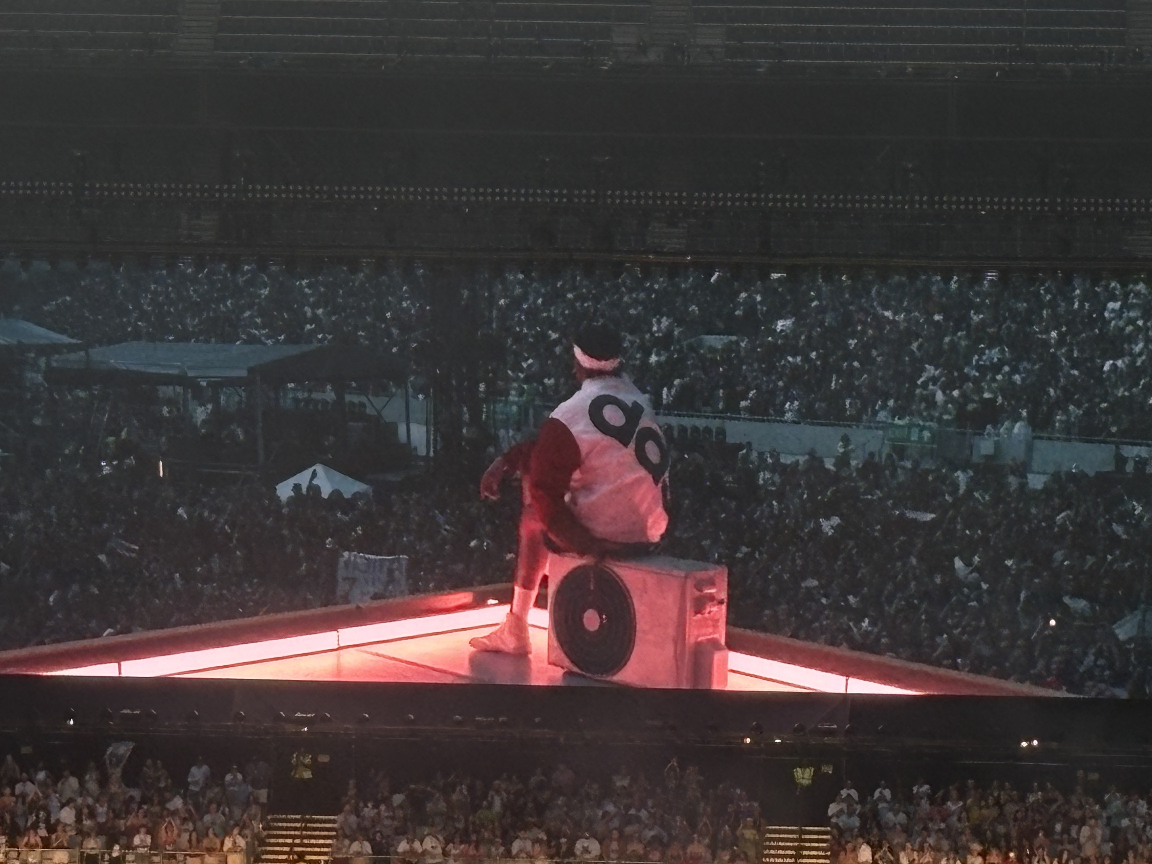 Bad Bunny performing to a stadium crowd