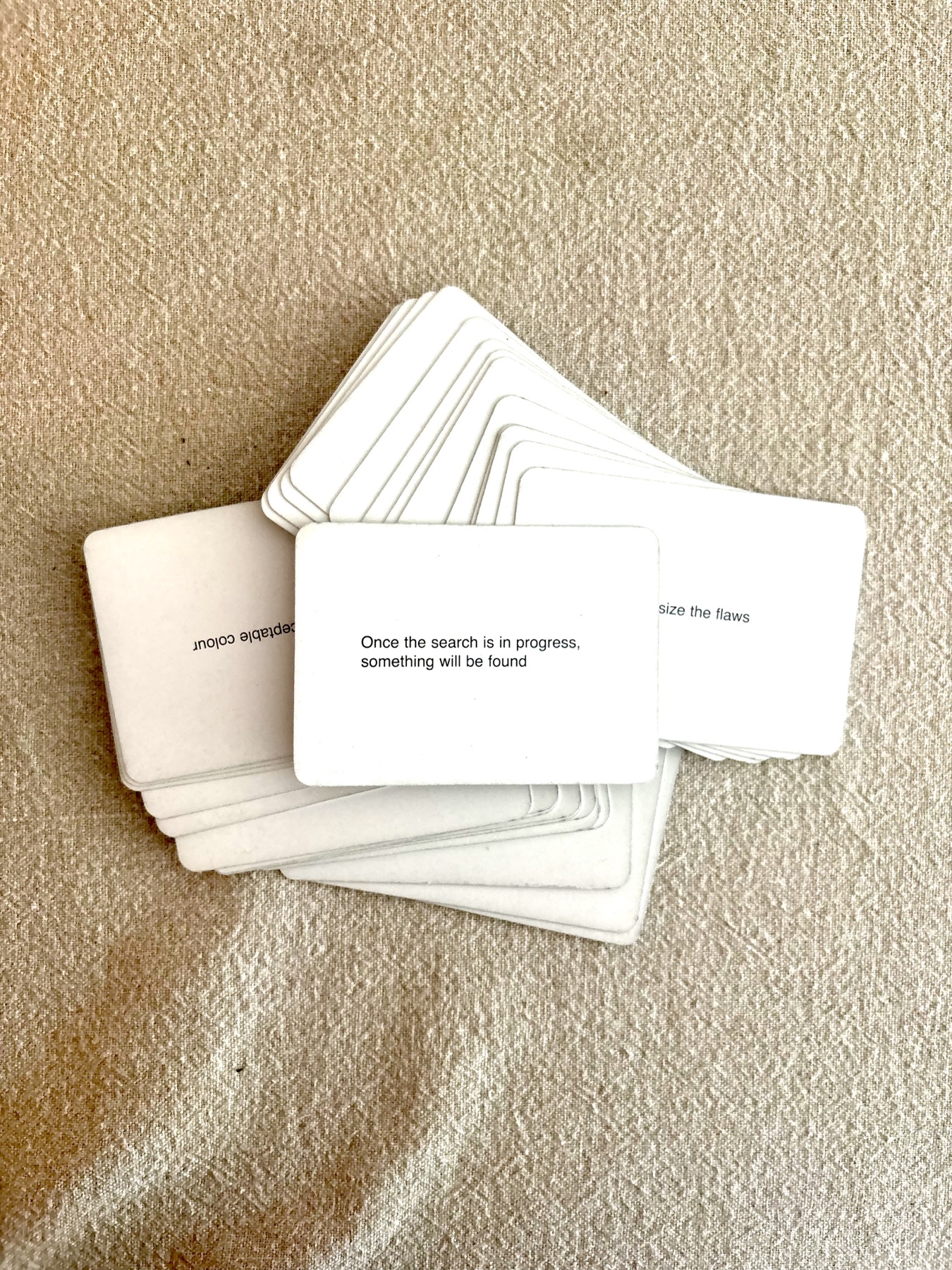 Jade’s Oblique Strategies cards spread across a textured surface