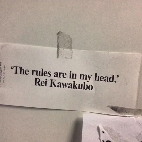 A taped clipping reading: The rules are in my head. Rei Kawakubo